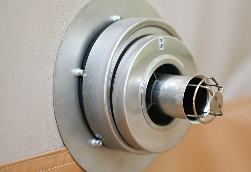 Close-up of Toyotomi FF heater’s pipe-within-a-pipe exhaust system