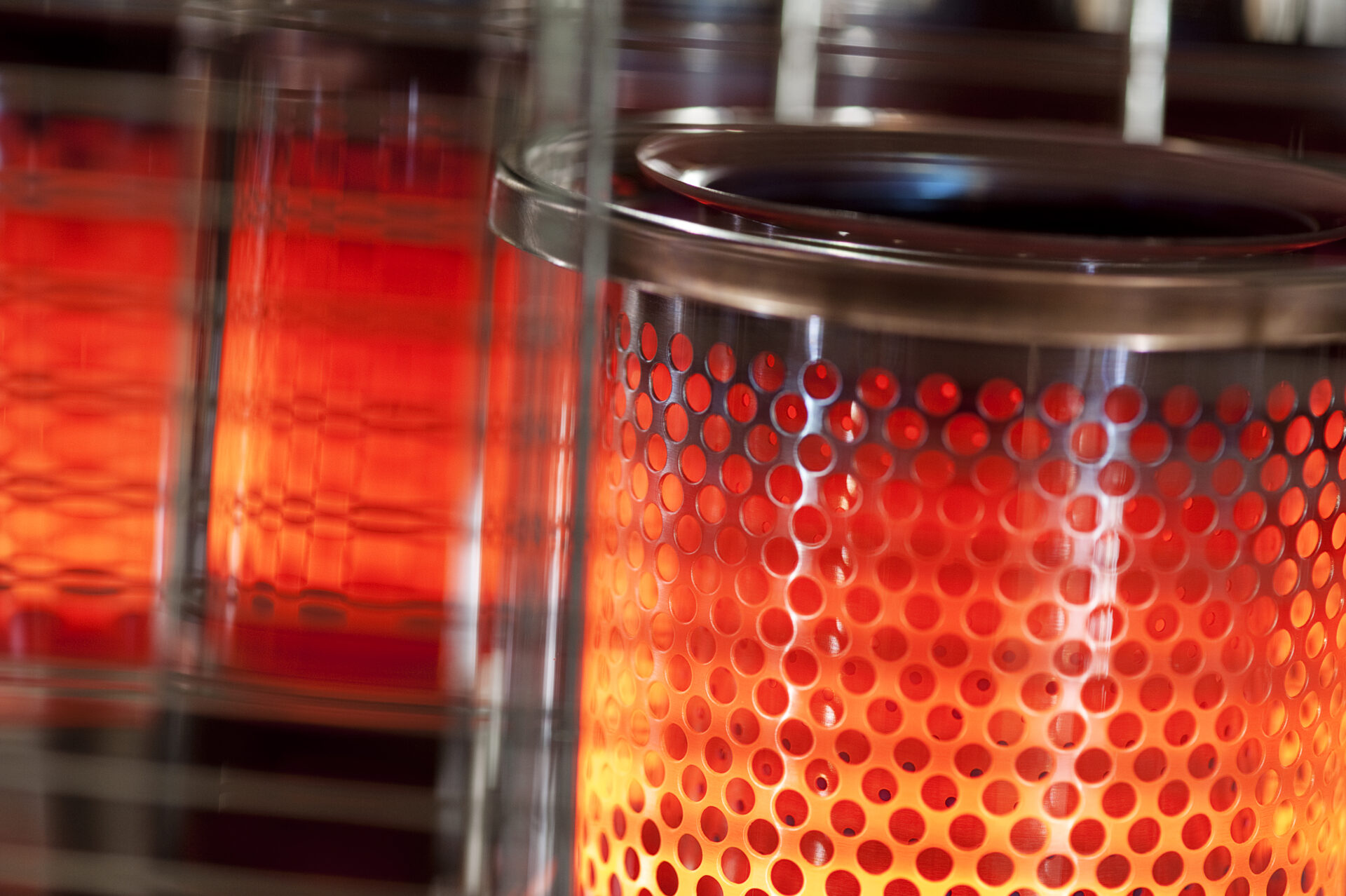 Toyotomi close up of a wick paraffin heater heat chamber glowing red.