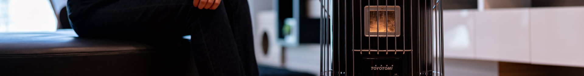 Toyotomi outdoor heater showcasing the omni 230 and heating up a women