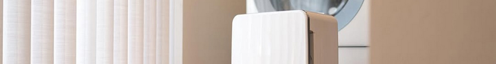 Toyotomi Dehumidifier in a laundry room dehumidifieng the room